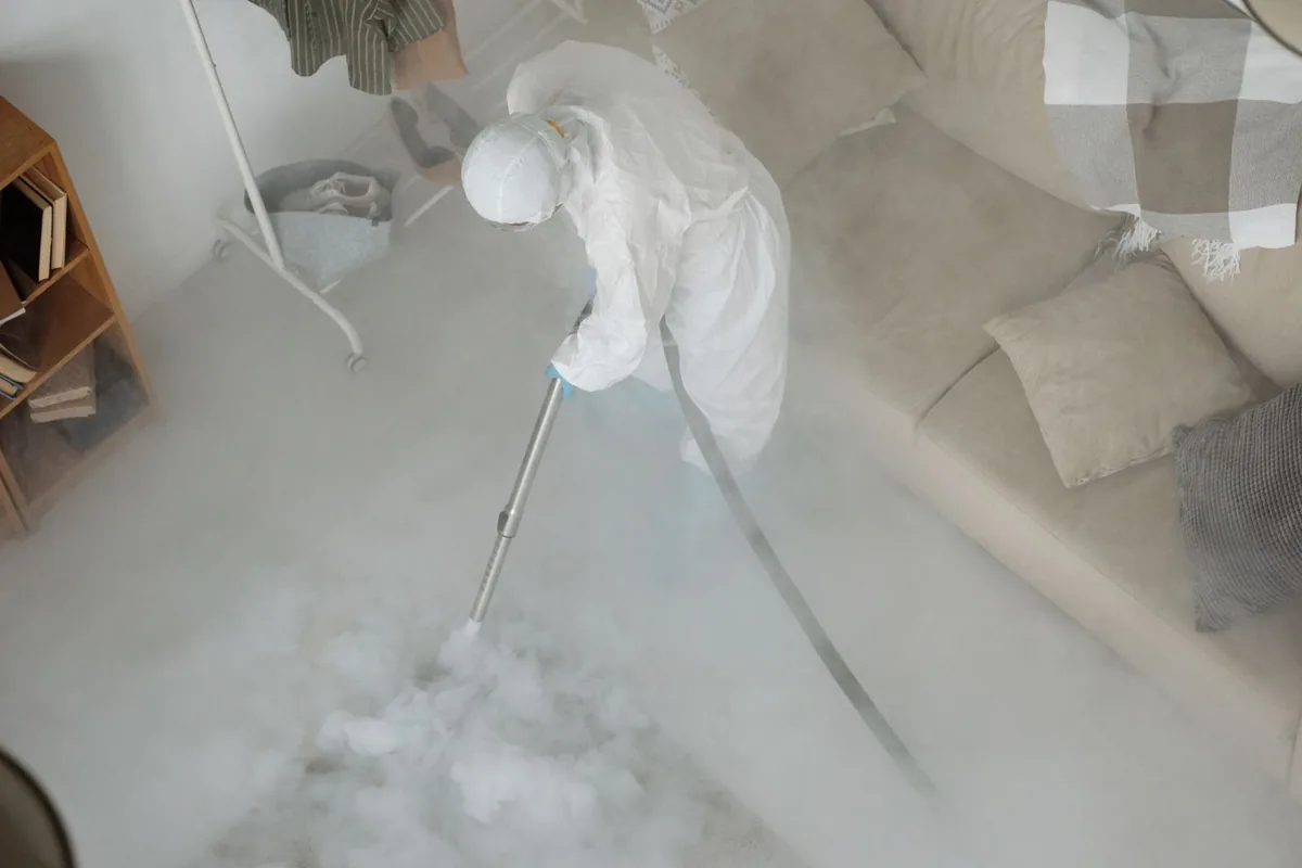 Biohazard cleanup technician in protective equipment, Millersburg, OR